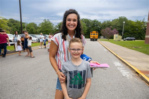 mom and girl student in the parking lot